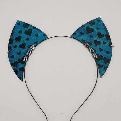 Blue cat ears with heart pattern on a white background